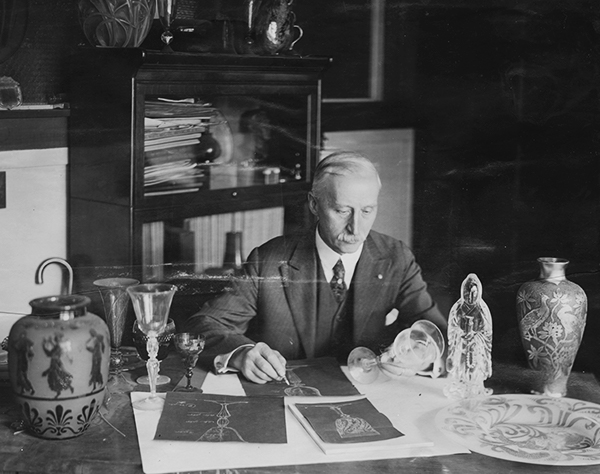 Frederick Carder at his desk